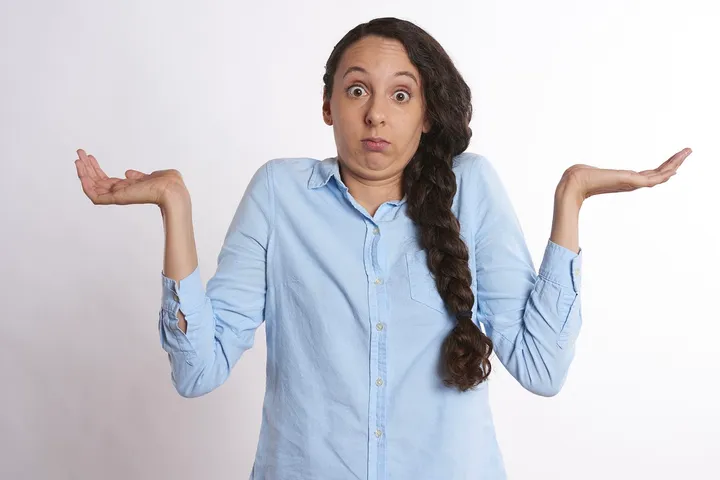 Stock image of a confused woman.